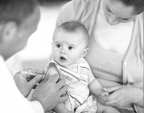 A baby gets their first vaccination. 